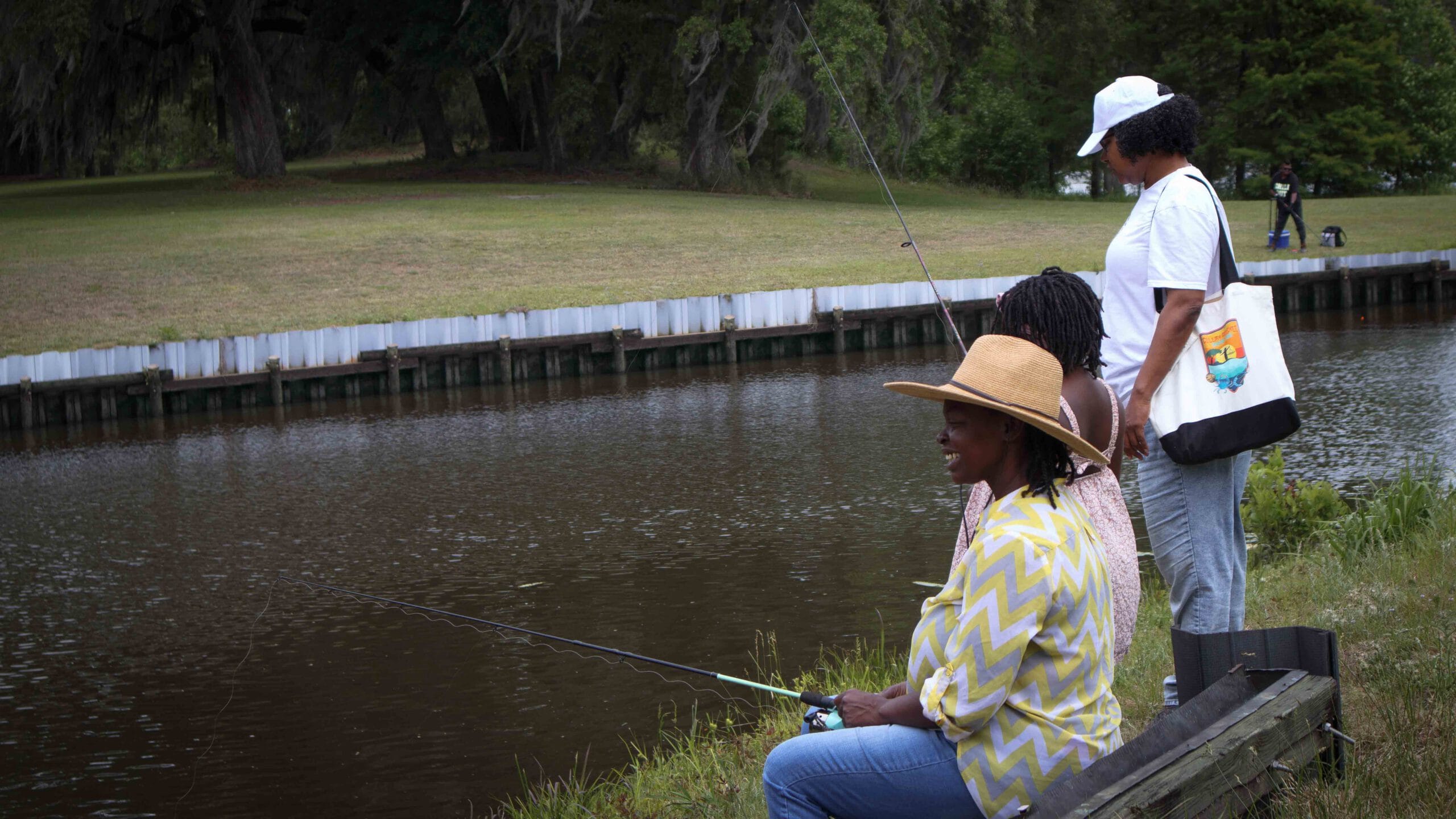 Woman fishing on the bank