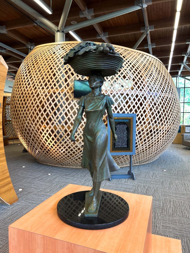 Statue of Gullah Geechee lady with sweetgrass basket on her head
