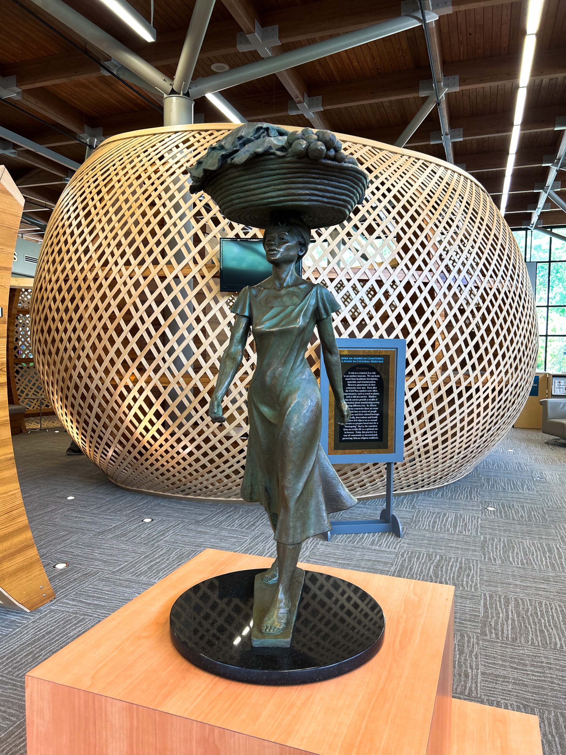 Statue of Gullah Geechee lady with sweetgrass basket on her head
